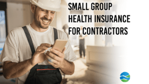 A smiling contractor shops for small group health insurance on his cell phone