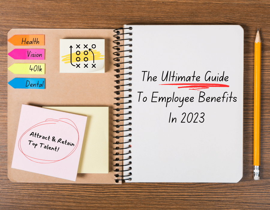 A notebook with "The Ultimate Guide To Employee Benefits In 2023" written on it is laid on a desk alongside post it notes and a pencil