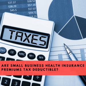 A calculator, pen and scattered papers appear behind a banner that reads "Are Small Business Health Insurance Premiums Tax Deductible?"