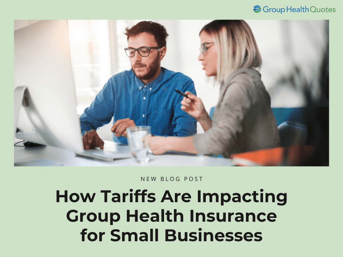 Two small business owners reviewing health insurance options on a computer, highlighting the impact of tariffs on group coverage.